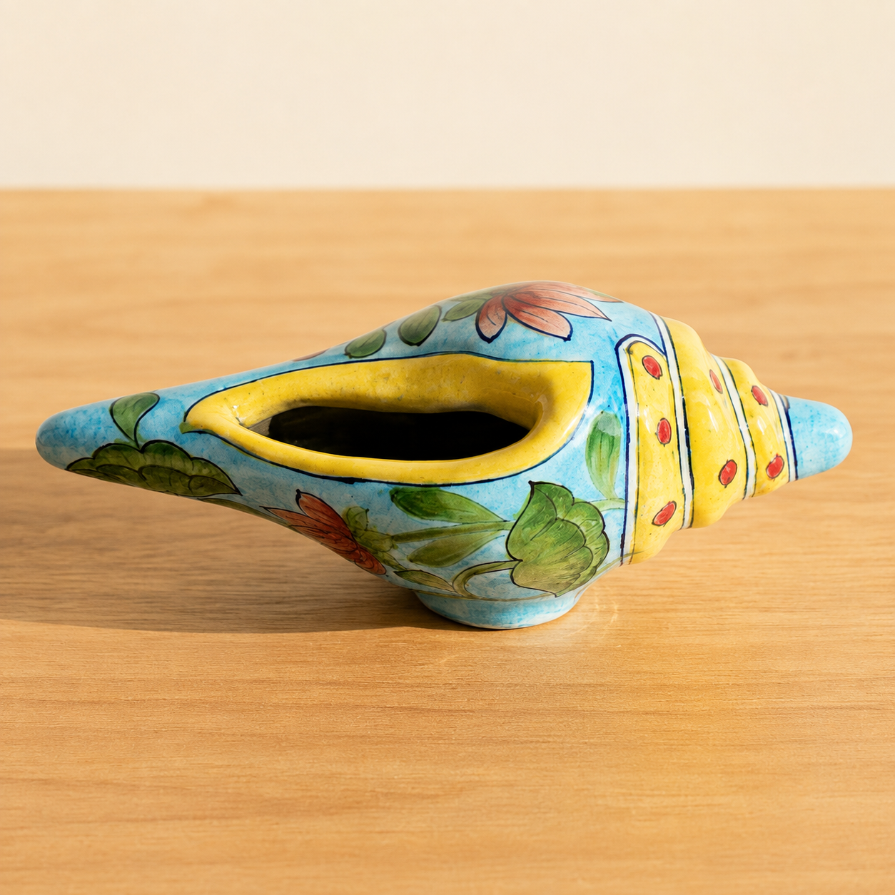 Aditya Blue Art Pottery handpainted terracotta and blue floral conch shell shankh on white background