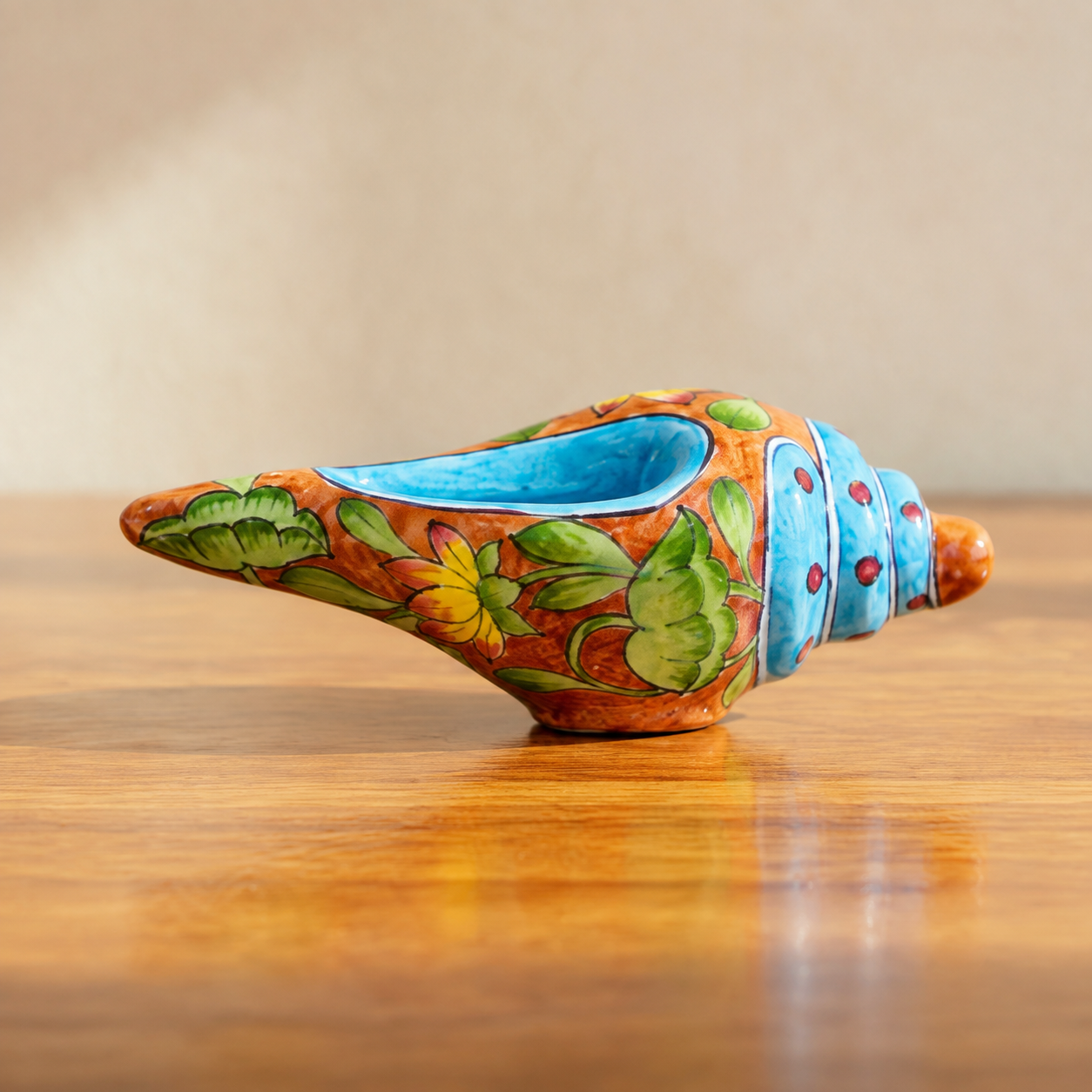 Aditya Blue Art Pottery handpainted terracotta and blue floral conch shell shankh on white background