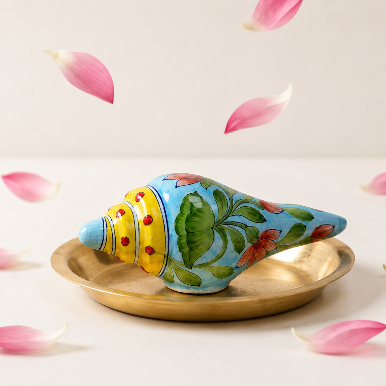 Handpainted yellow lotus floral details on Jaipur blue pottery conch shell by Aditya Blue Art Pottery
